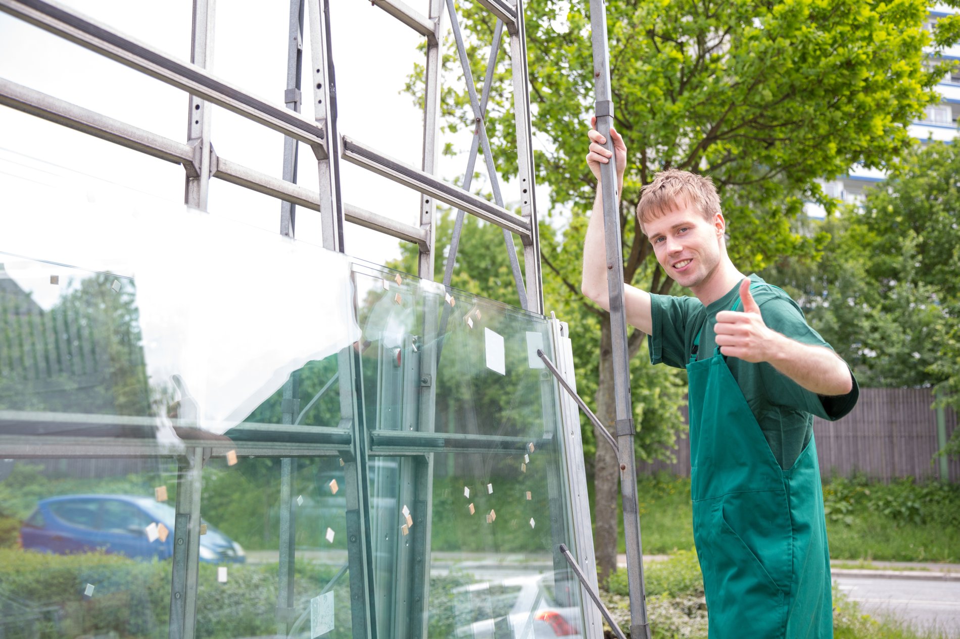 Glazier handling glass installation