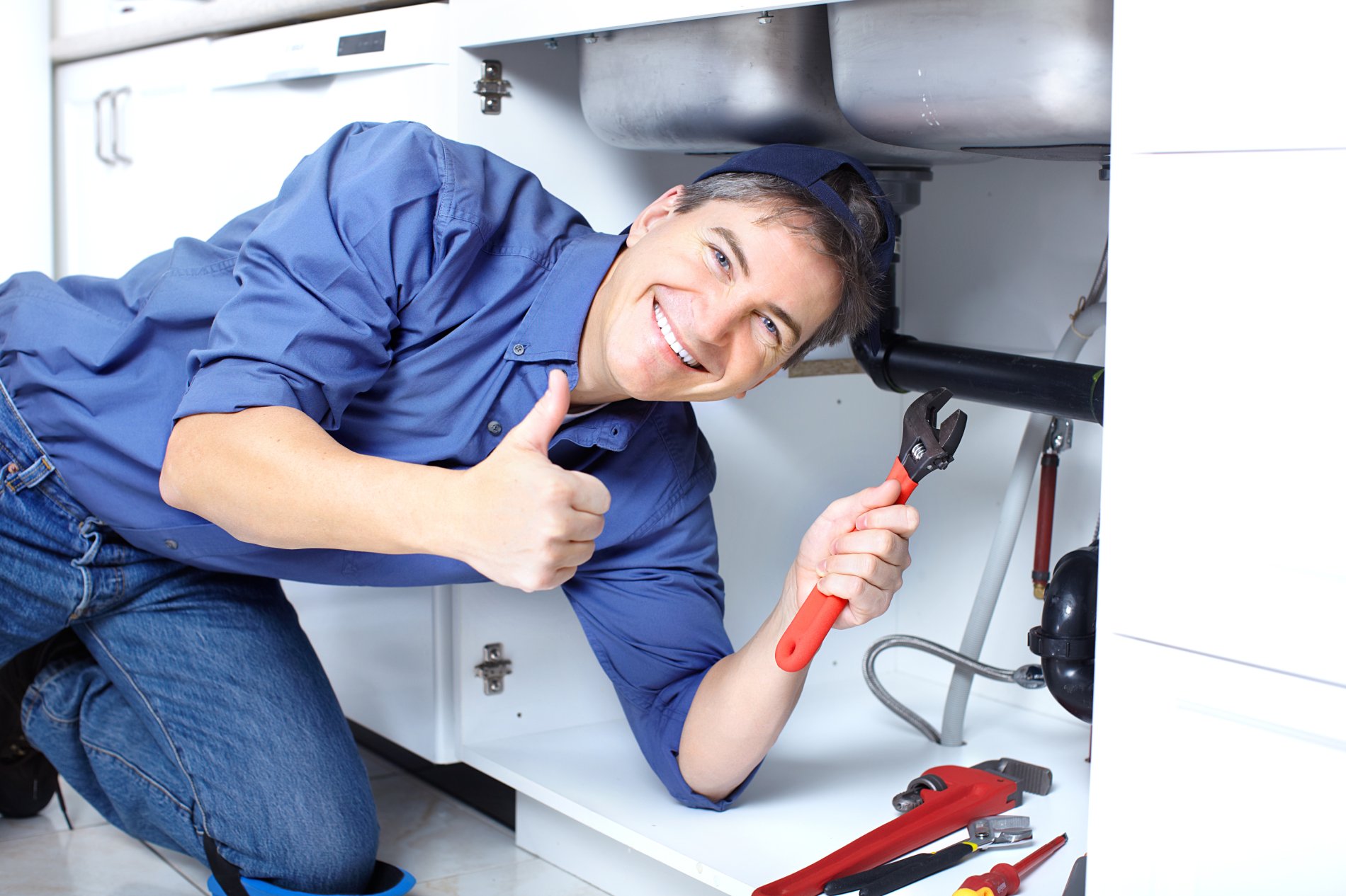Plumber fixing pipework